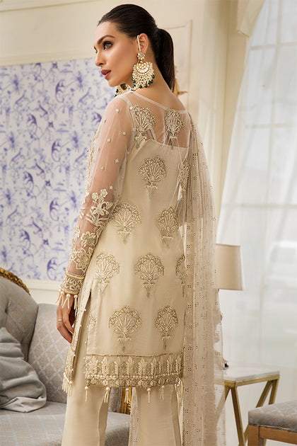 pearl work dress design This white dress is crafted from luxurious pure silk and adorned with delicate pearl work. The embellishment highlights the Sanan sleeves, neckline, and flows gracefully across the entire shirt, giving the piece