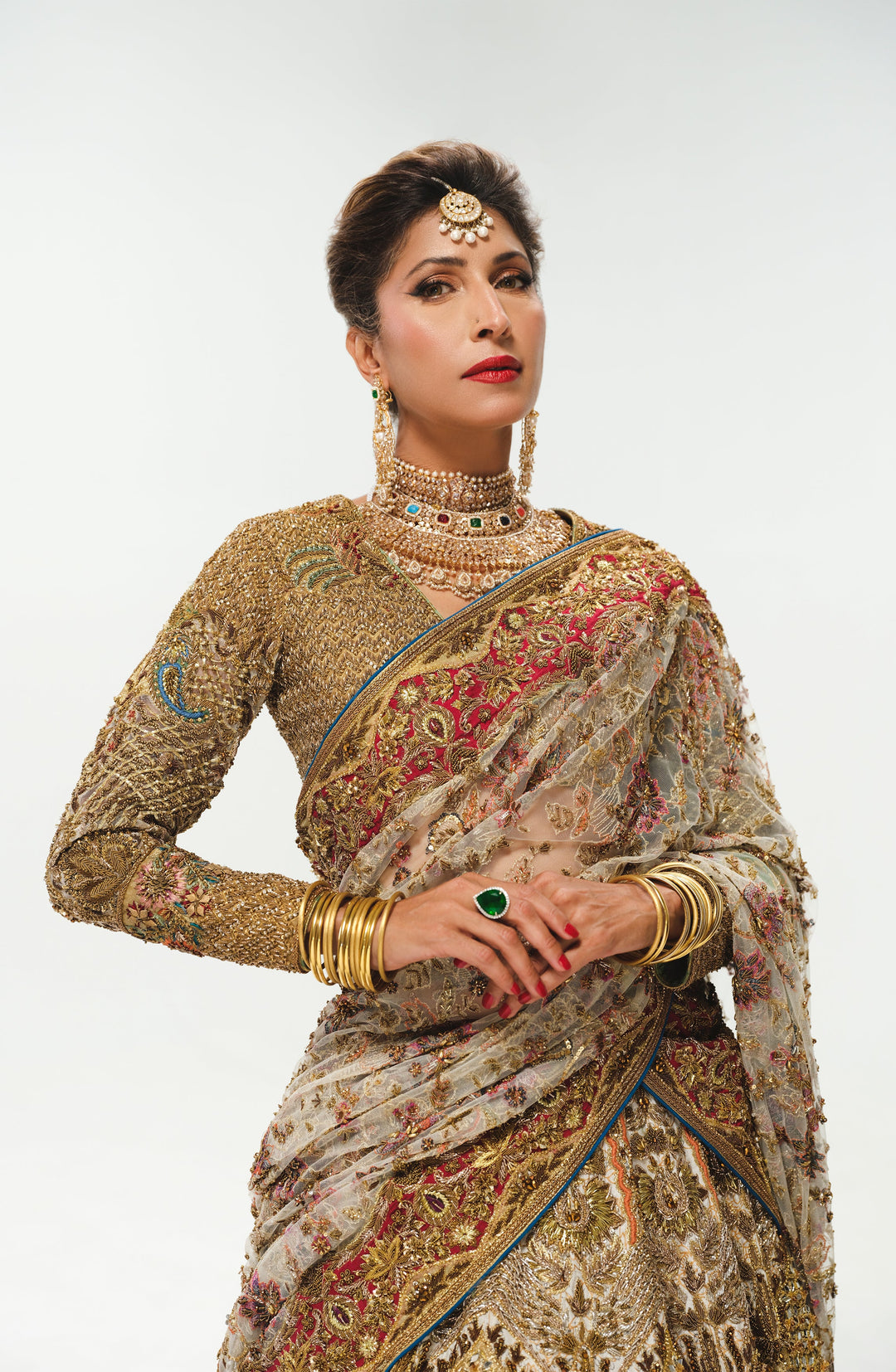 Elegant White Pakistani Bridal Lehenga with Colorful Embellishmen