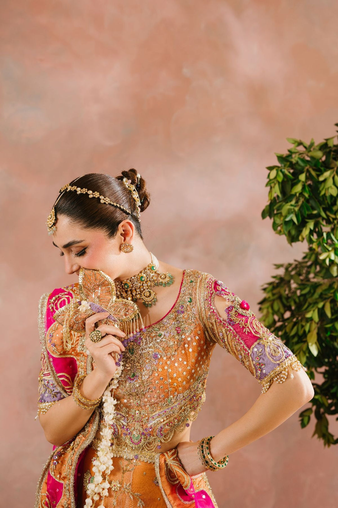Latest Pakistani Bridal Dress in Choli and Rust Lehenga Style