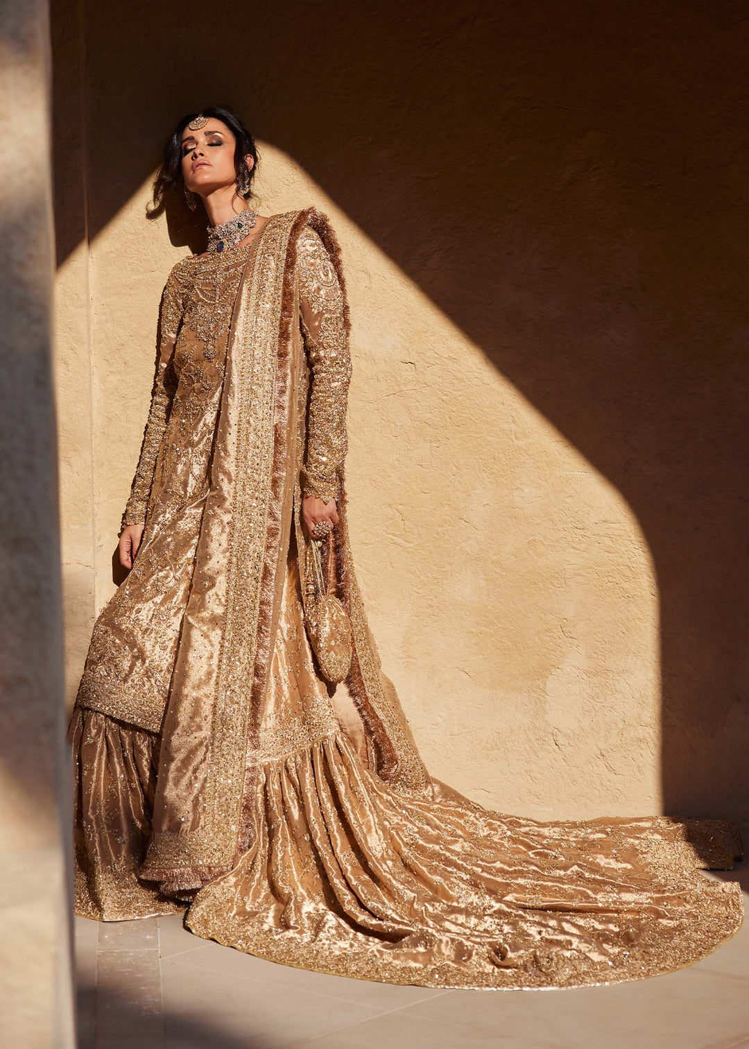 Latest Pakistani Bridal Dress in Gold Lehenga Kameez Style