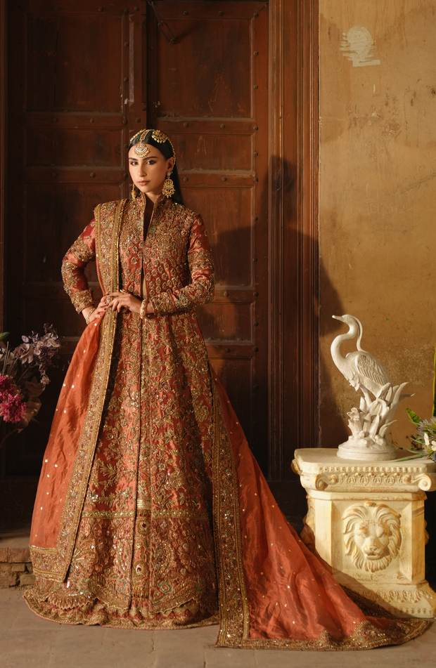 Copper-Rust Pakistani Bridal Dress with Dramatic Flair