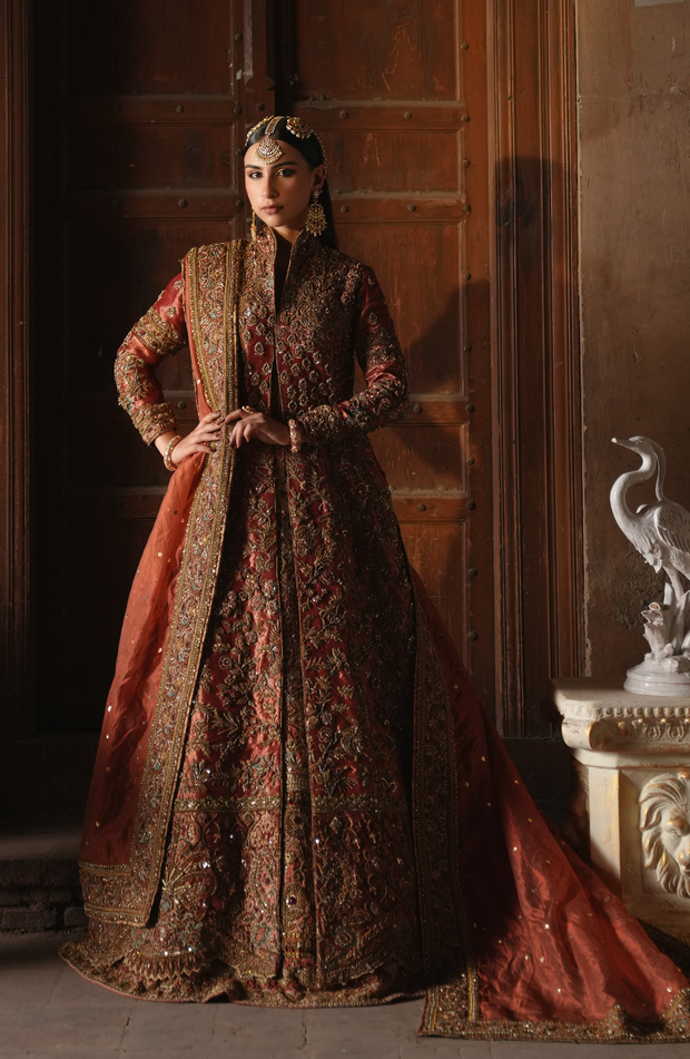 Copper-Rust Pakistani Bridal Dress with Dramatic Flair