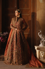 Copper-Rust Pakistani Bridal Dress with Dramatic Flair
