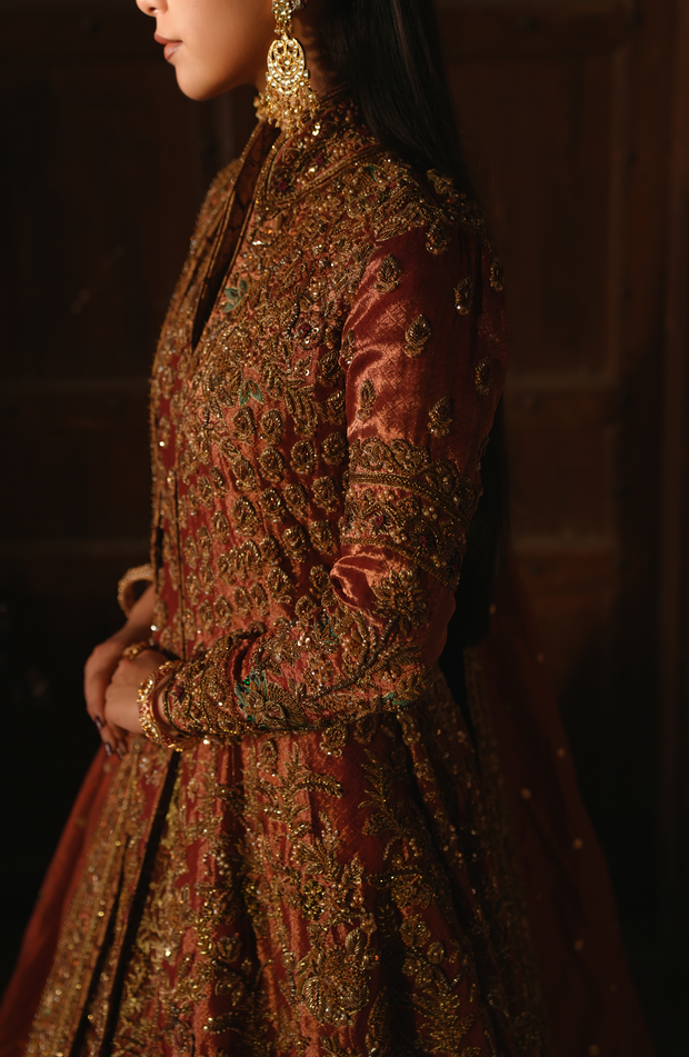 Copper-Rust Pakistani Bridal Dress with Dramatic Flair