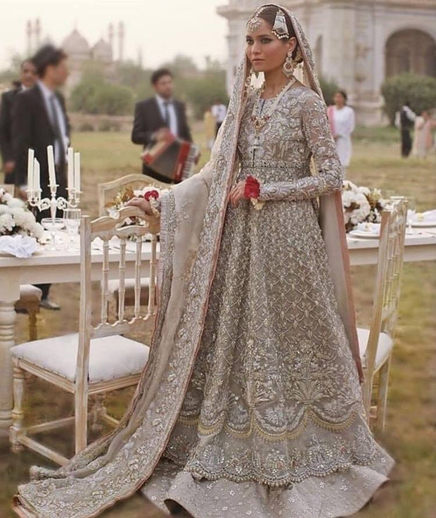 Best Walima Dulhan Lahnga In Light Gray And Pink Color.Work Embalished With Dabka Zari Nagh And Sequance Work In Beutifull Maxi And Farshi Lahnga Style.
