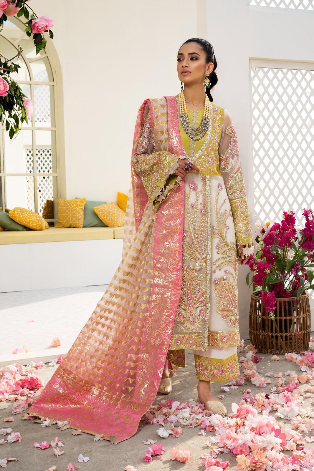 Indian Party Dress In Beutifull Light Green Color By Elan.Work Emballished With Sequance,Dhaga,Pearls Nagh And Tilla Threads Embroidery.