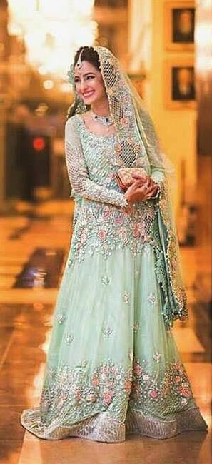 Bridal maxi in mint green color with heavy dabka threds crystals pearls nagh and cutwork Model#B1005