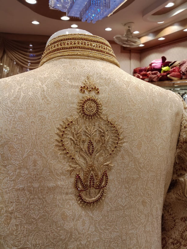 Dulha Sherwani With Turban In Beautiful Golden Color.Work Embellished With Maroon Nagh,Dabka,Zari,And Zardozi Work.