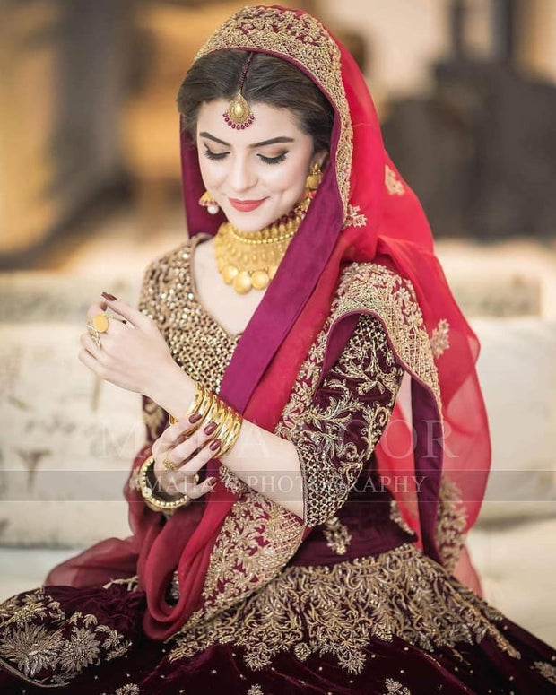 Bridal Reception Lahnga In Dark Maroon Color.Work Embalished With Pure Dabka Zari Sequance And Stone Work.