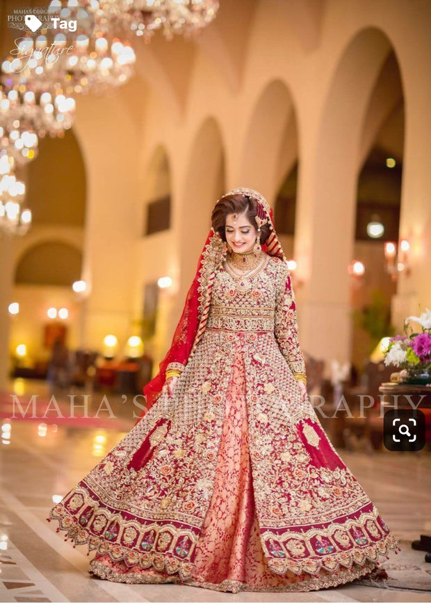 Pakistani Dulhan Maxi In Beutifull Hot Red Color.Work Embellished With Pure Dull Gold Dabka,Zari,Naqshi,Sequance,Pearls And Moti Work.