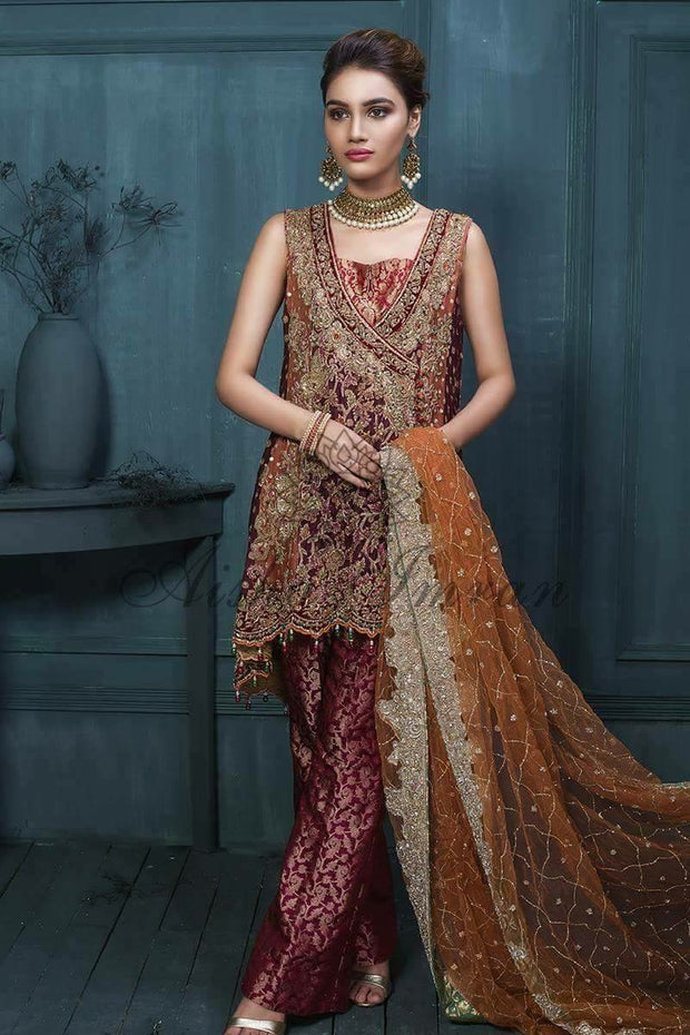 Beautiful bridal dress in maroon and copper color in paplam style