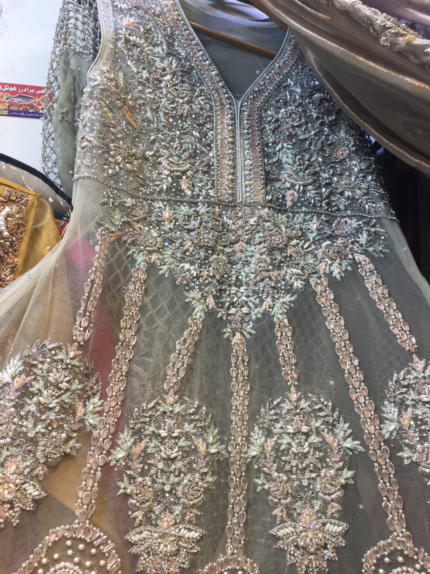 Heavy Wedding Dress In Beutiful Pinkish Gray Color.Work Embellished With Pure Dabka Crystals Nagh,Pearls Moti & Sequance Work. In Beutiful Paplam Style. This Style Can B Custumized In Any Type Of Shirt Shape. (B,,T, Zar,)