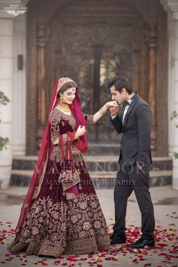 Bridal Reception Lahnga In Dark Maroon Color.Work Embalished With Pure Dabka Zari Sequance And Stone Work.