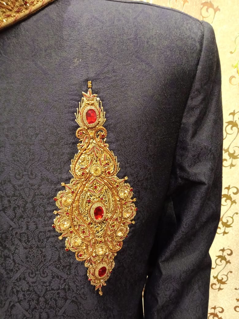Latest Sherwani In Blue Jamawar Fabric.work Embellished With Ban,Cuff And Buttons With Pure Dabka,Zari,Zardozi & Stone Work.