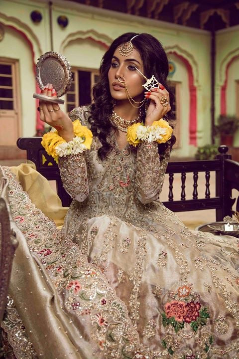 Beautiful bridal lahnga in red and gold with heavy dabka nagh pearls threds and crystals work 