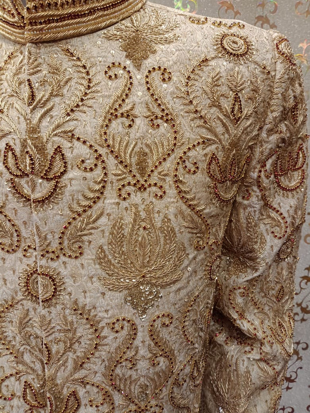 Dulha Sherwani With Turban In Beautiful Golden Color.Work Embellished With Maroon Nagh,Dabka,Zari,And Zardozi Work.