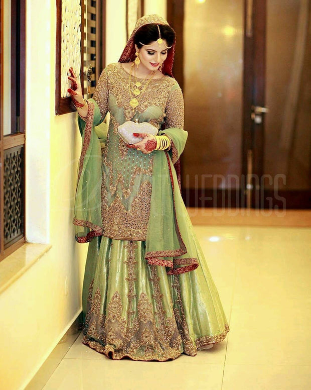 Traditional Walima Lahnga In Parrot Green Color.Work   Embalmed With Pure Dabka Nagh Zari Nagh Perarls And Cutwork.