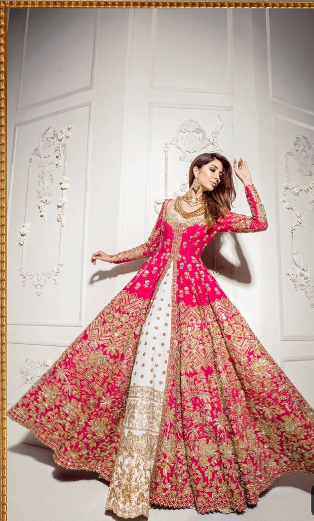 Stylish Bridal Lahnga In Beautifull Shoking Pink Color. Work Embellished With Pure Golden,Dabka,Zari,And Naqshe Work.Bridal Dress Based On Open Long Maxi And Lahnga in offwhite Color.