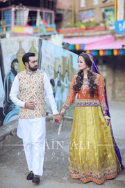 Stylish Mehndi Attire In Orange Green And Purple Color.Work Embellished With Dabka Zari And Gota Work.