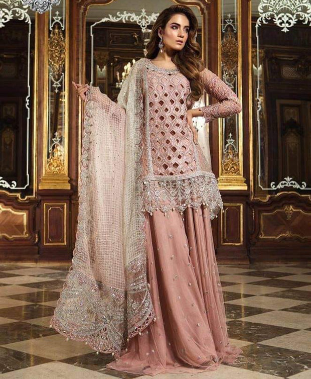 Pakistani Bridal Sharara in Beutiful Baby Pink Color By Maria.B With Cutwork Jaal,Handwork,Sequance,And Tilla Threads Embroidery. 