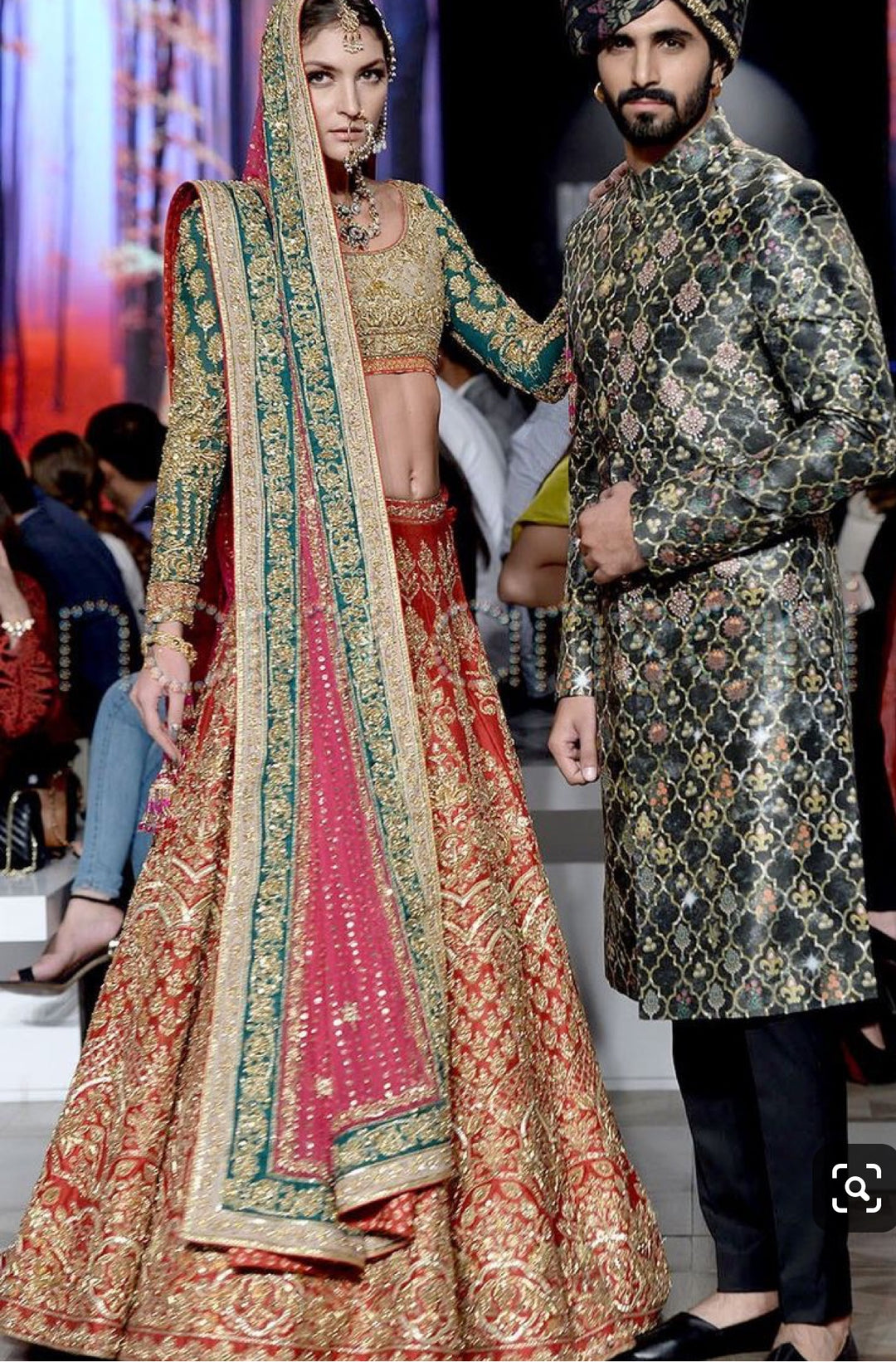 Nomi Ansari Bridal Lahnga Choli In Hot Red Color In In Indian Style.Work Embalished With Pure Dull Gold Dabka,Zari,Nagh Sequance And Green Appliqué Work.