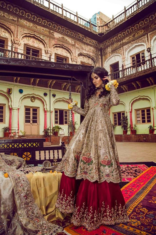 Beautiful bridal lahnga in red and gold with heavy dabka nagh pearls threds and crystals work 