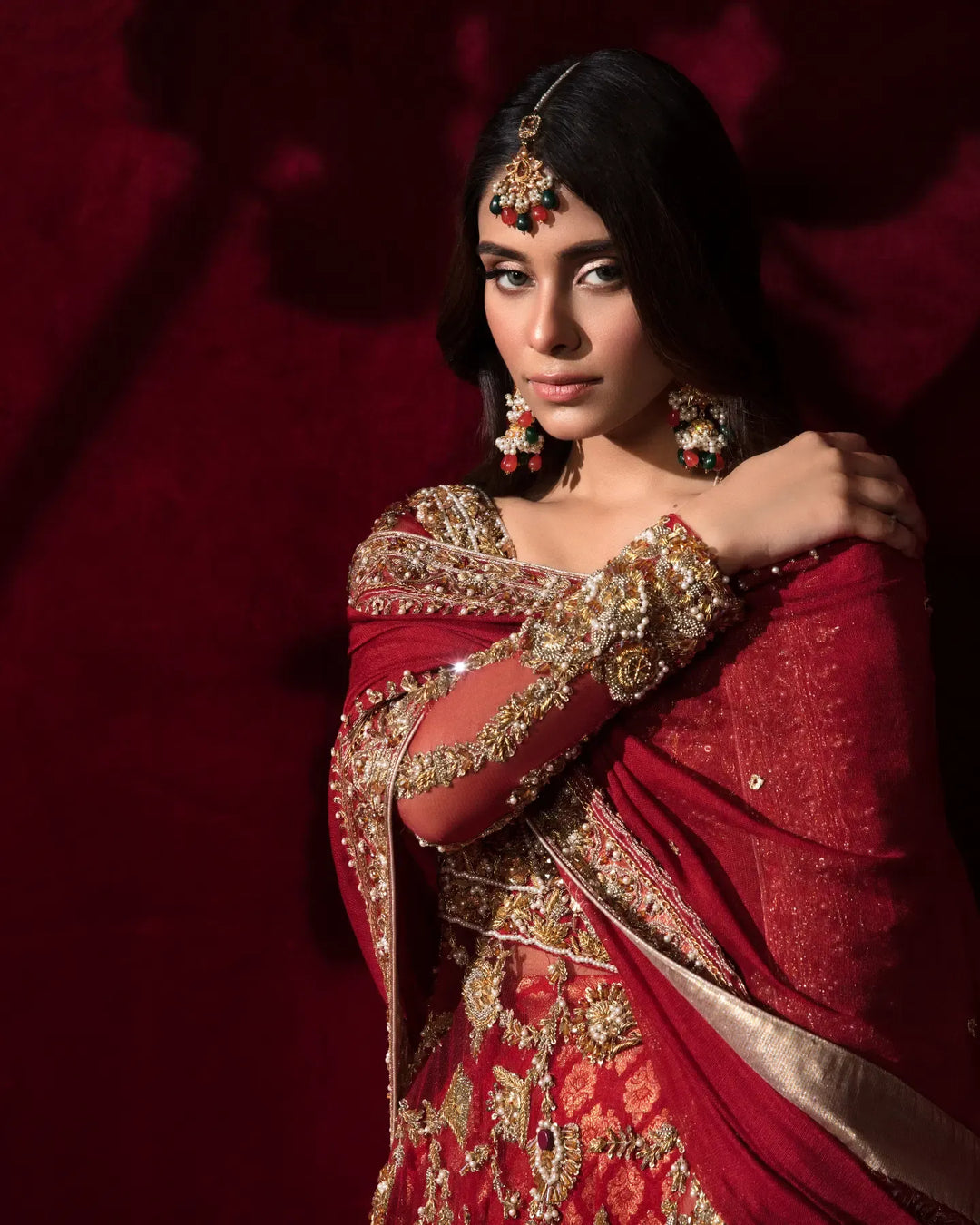 Stunning Red Pakistani Bridal Dress in Peplum Lehenga