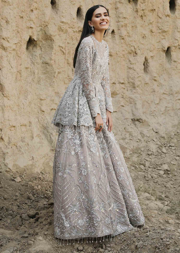 peplum indian dress Peplum Bloom Amethyst tones meet a blooming peplum silhouette in this modern wedding-wear look. The embroidered top and flowy palazzos bring an effortless charm to every function Shine through every