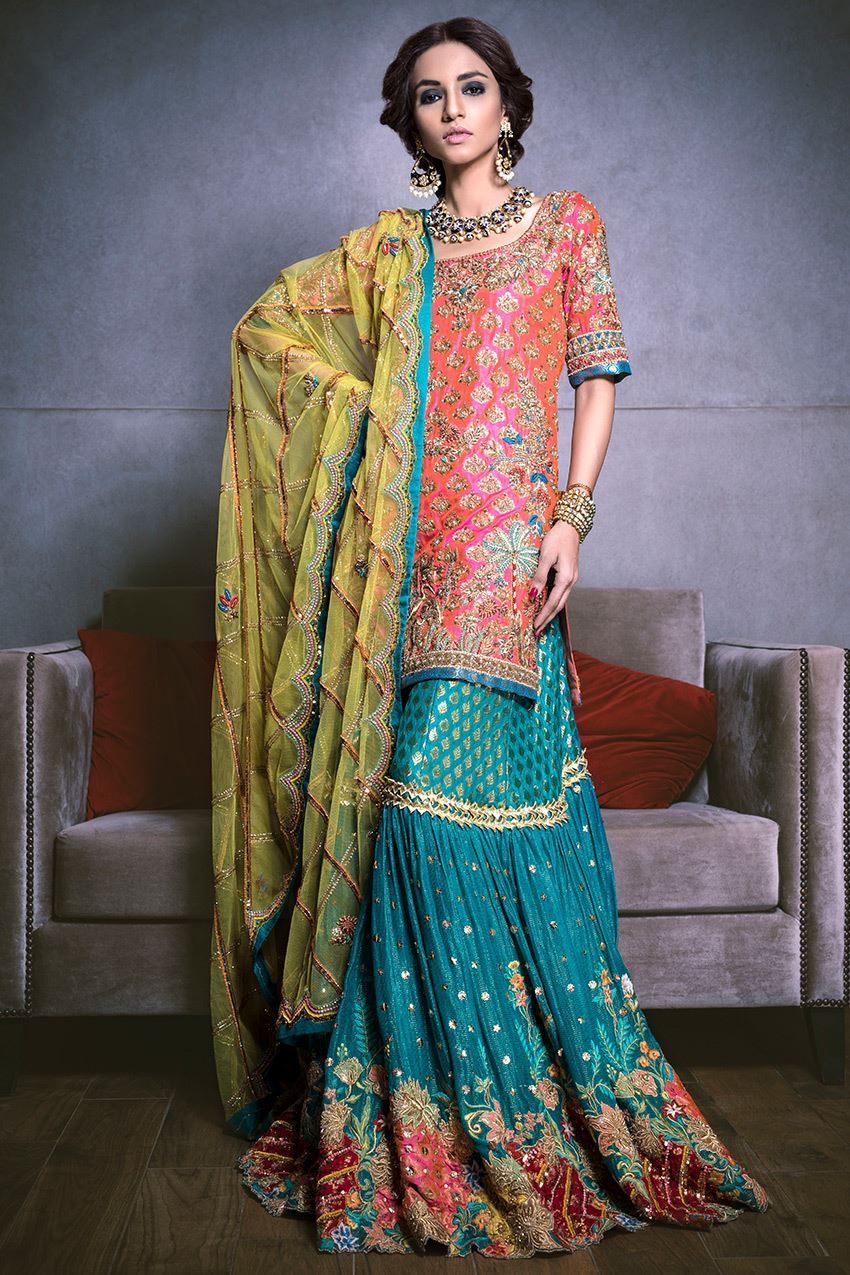 Beautiful bridal mehndi lehnga in orange and turquoise color