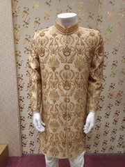 Dulha Sherwani With Turban In Beautiful Golden Color.Work Embellished With Maroon Nagh,Dabka,Zari,And Zardozi Work.