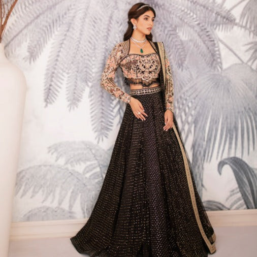 Gold sequins work lehenga with black kundan work blouse and black dupatta.  Blouse and dupatta color