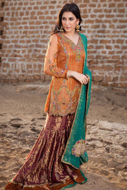 Pakistani designer gharara dress in copper and orange color