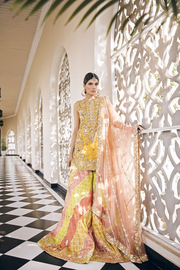 Beautiful embroidered designer mehendi outfit in yellow color