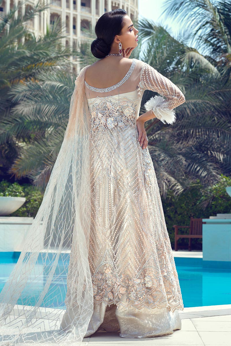 Latest designer net embroidered outfit for party wear in peach color