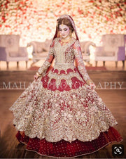 Dulhan Bridal Dress In Beutifull Maronish Red Color.Work Embellished With Pure Dull Gold Dabka Naqshee,Zari,Tilla,Crystal,Stone,And Dhaga Work.This Dress Is Proper Customized. Can Customized In Any Color.And Also Can Change Desiring Fabric.