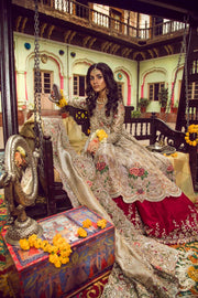 Beautiful bridal lahnga in red and gold with heavy dabka nagh pearls threds and crystals work 