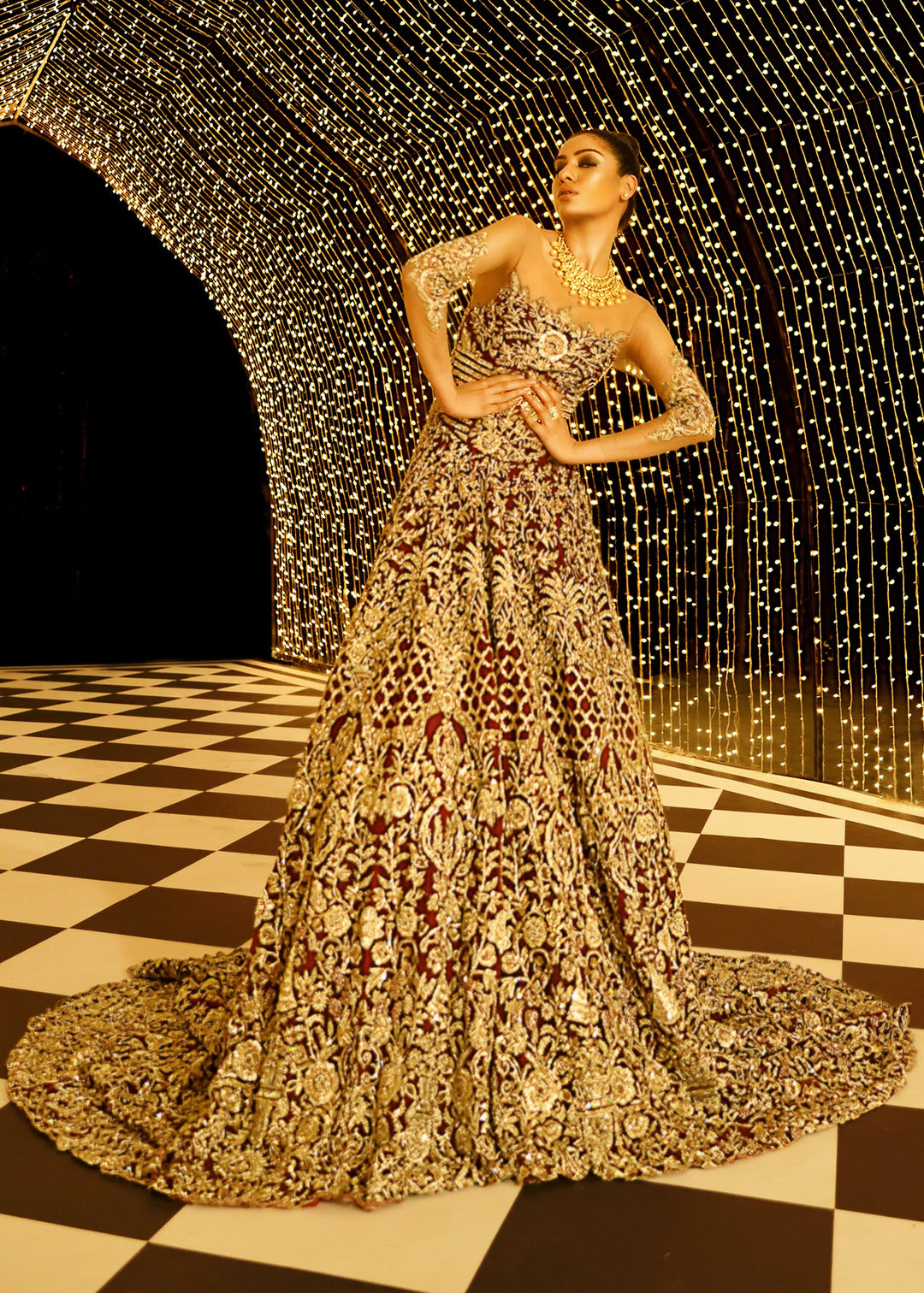Embroidered gown dress in maroon color with dull gold work
