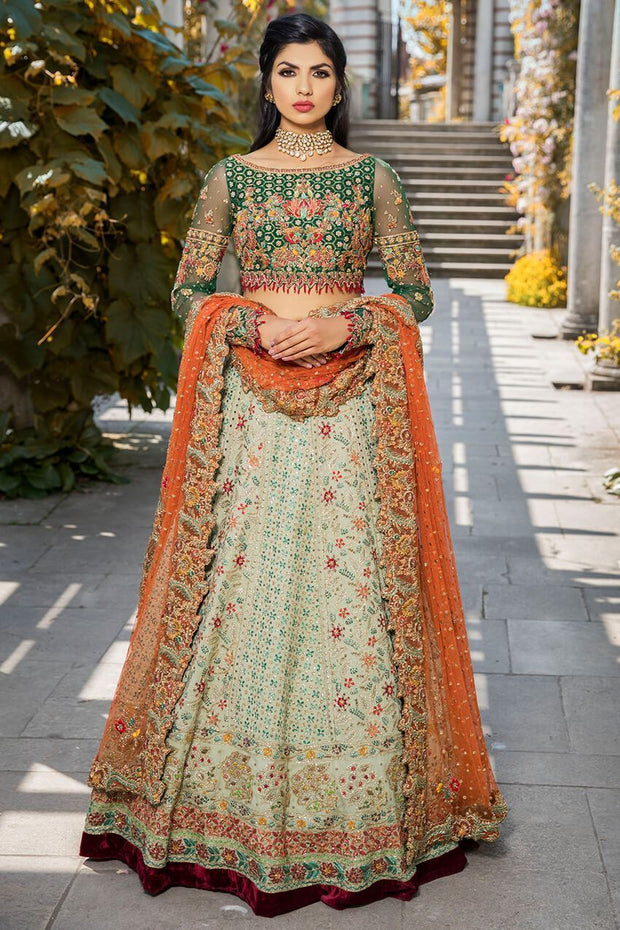 Elegant bridal dress in ghaghra choli style in green color