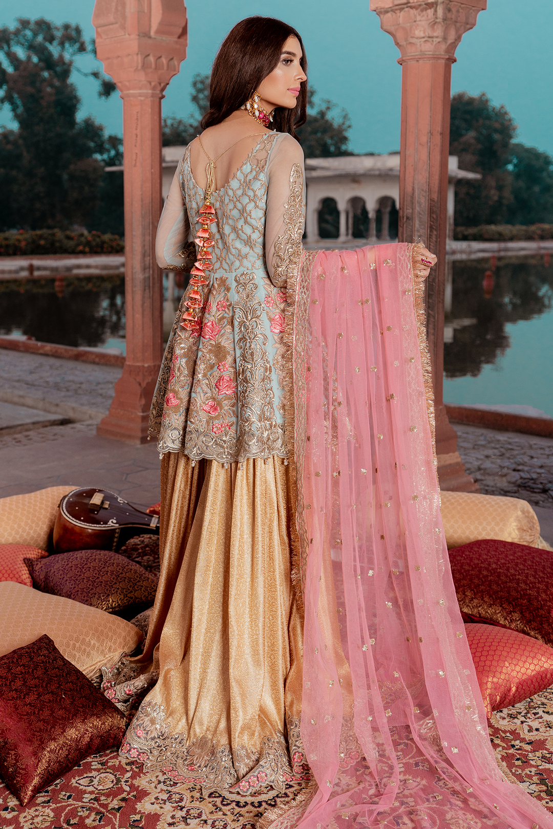 Pakistani net embellished party dress in blue and gold color # P2451