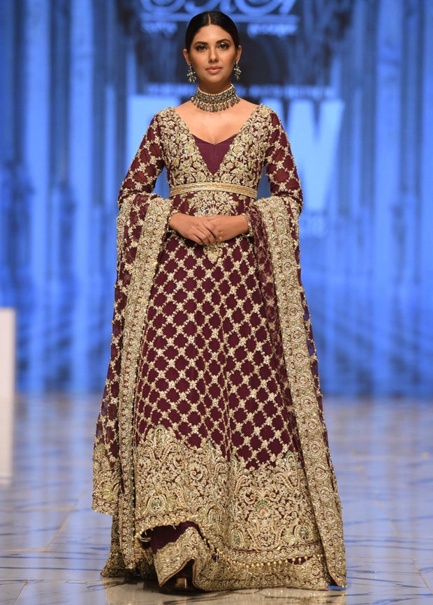 Embroidered bridal frock in maroon color with skin gold embroidery 