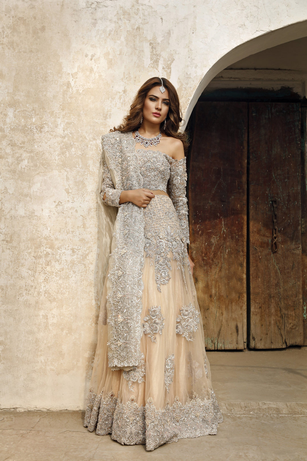 Latest Pakistani embroidered walima dress in lavish peach color