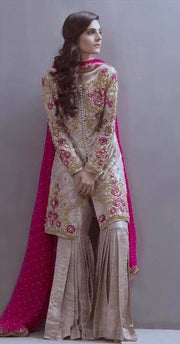 Beautiful gharara set in shoking pink and skin gold color