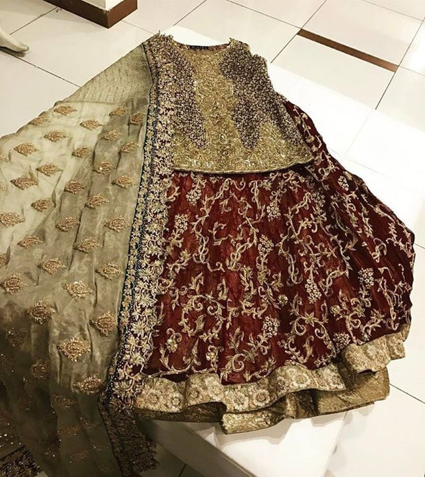 Sham pine gold and maroon lahnga set with dabka nagh and naqshee work Model#L 19
