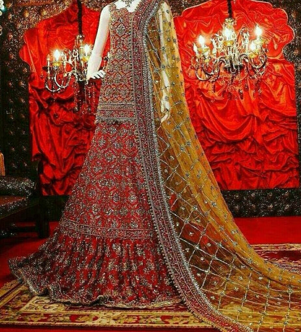 Beutifull bridal lahnga in maroonish red and greenish golden color