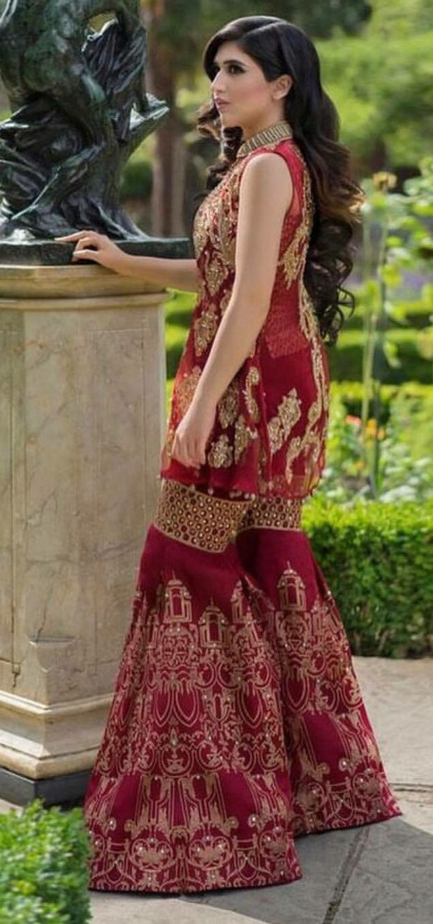 Wedding party dress in maroon and golden color with nagh perls sequence and dabka zari work Model #P 535
