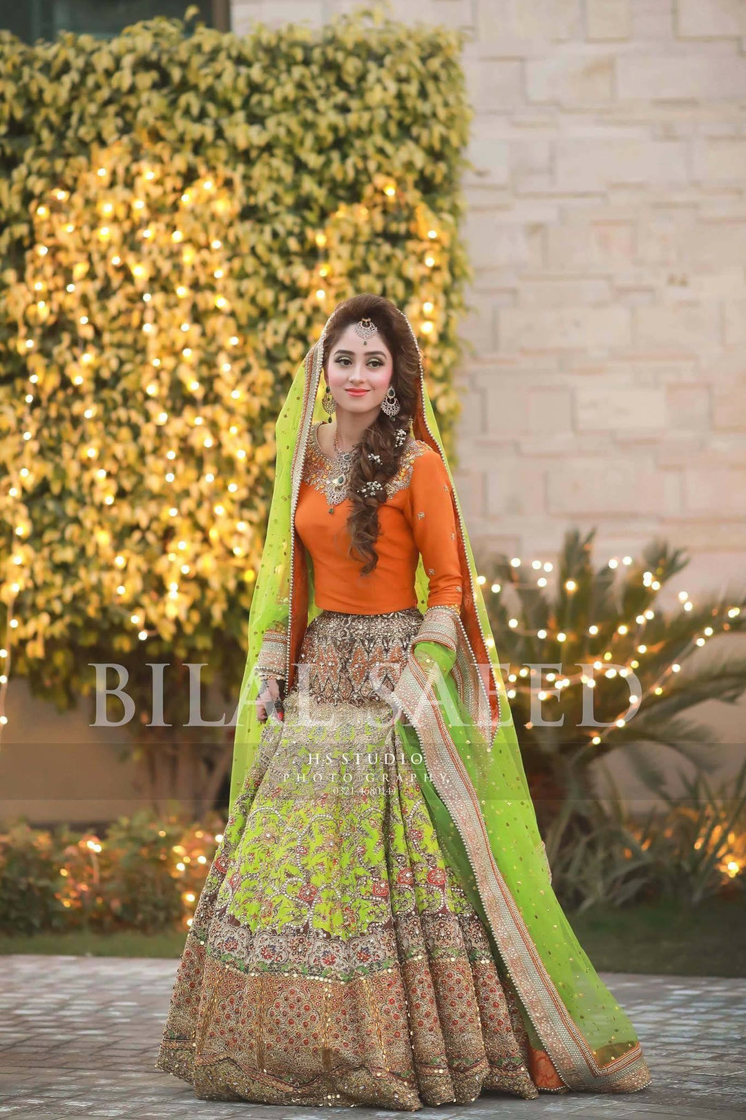 Orange and green lhnga for mehndi bride work with blockprinting dabka sitara and threads  Model#M47