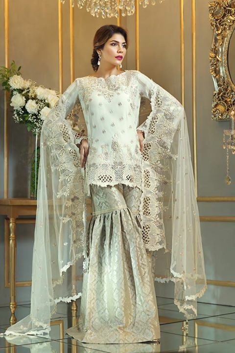 Chiffon dress by Anya in light golden color with threds tila embroidery and patch works Model#C 572