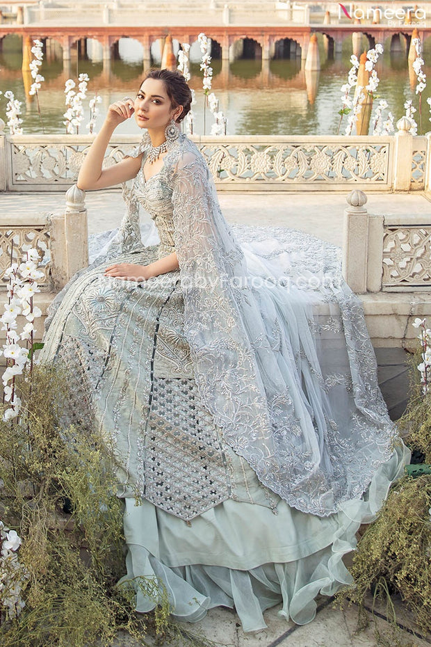silver indian wedding dress Delicately crafted white and silver bridal look. The 3 part set takes inspiration from French florets over a soft cotton colored net canvas. Lehenga comes lined with silver and white jacquard. #Netfabricbridal #