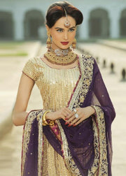 Latest Indian embroidered bridal outfit in gold and purple color 