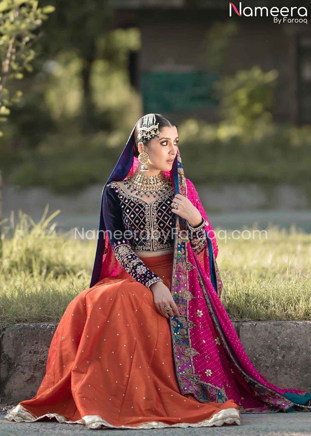 orange lehenga with blue blouse